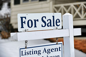 For Sale sign with Listing Agent sign